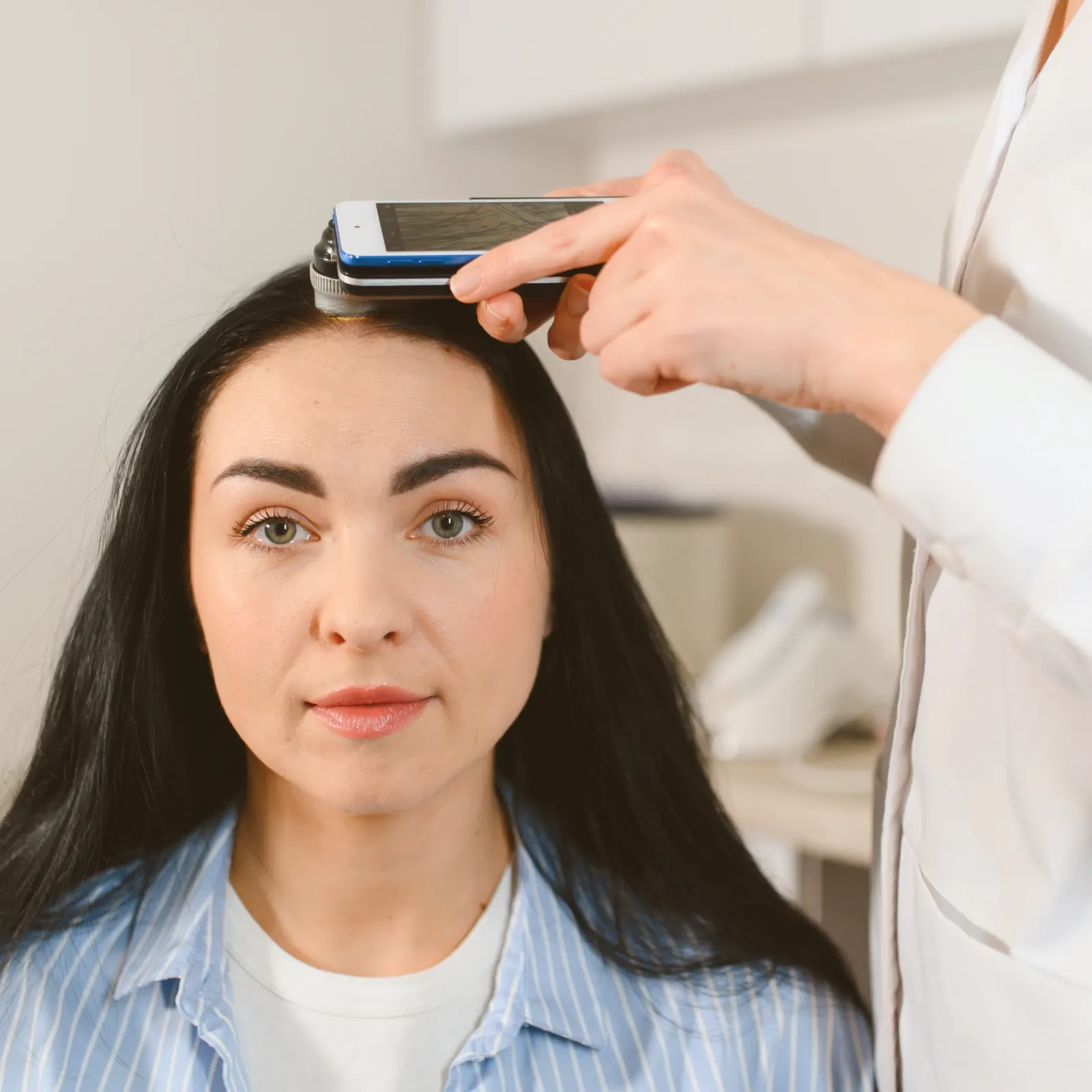 Dr Bonaros assessing a patient's suitability for a hair transplant